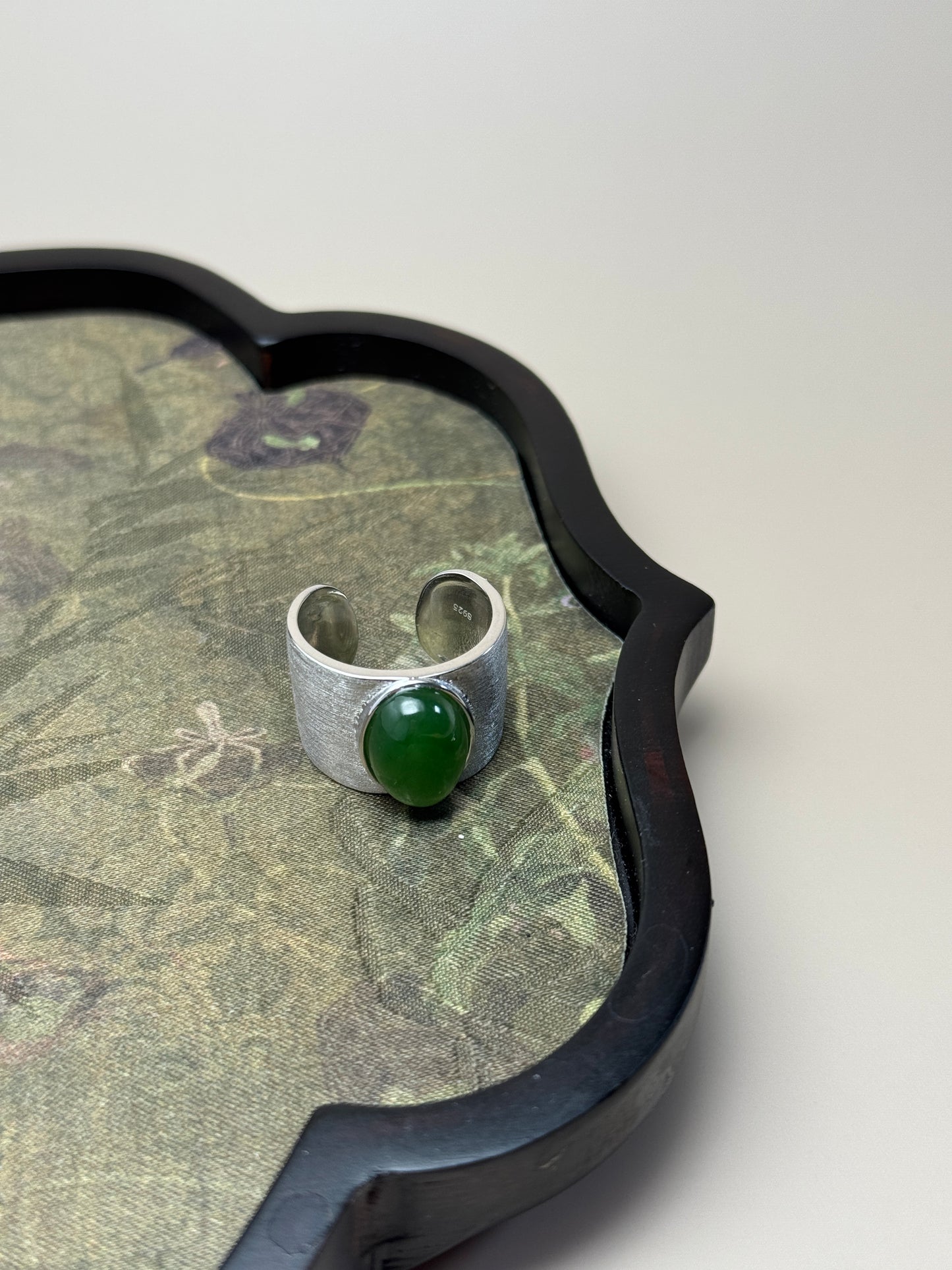 Minimalist Hetian jade ring with brushed silver bezel, symbolic Earth element jewelry