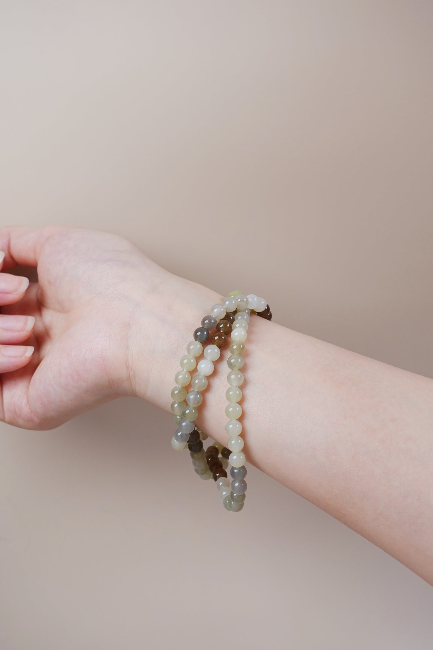Loulan Hetian jade bracelet necklace in ink, white, and amber-brown tones representing the Five Elements