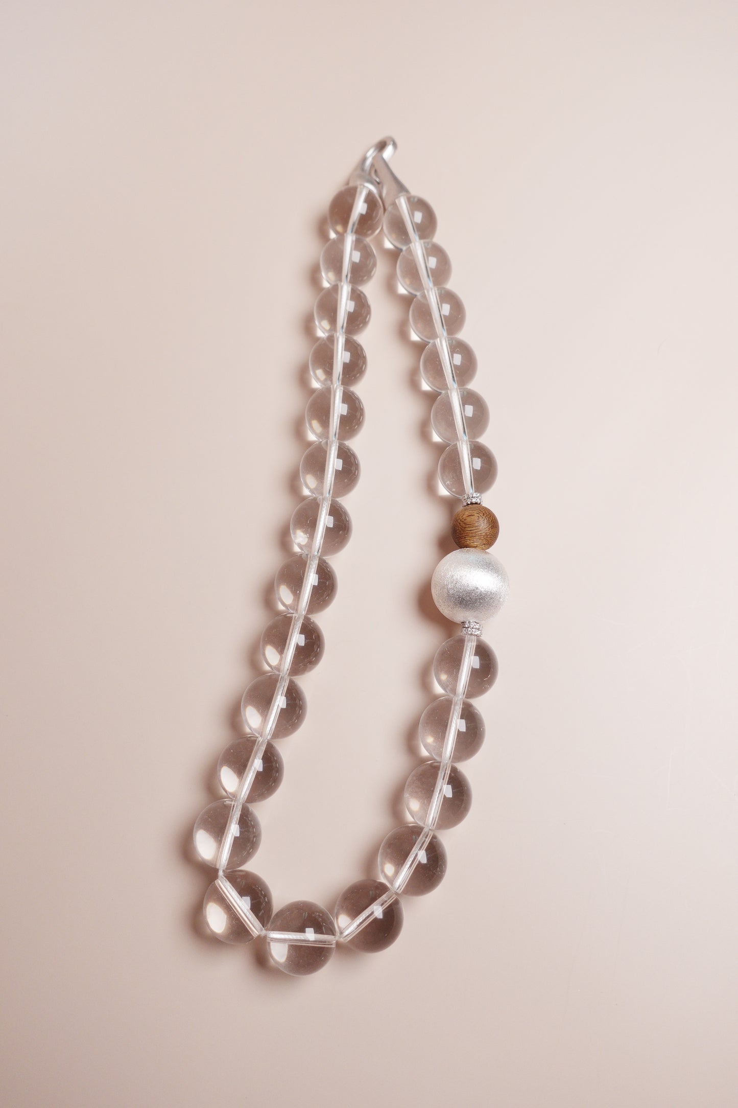 white crystal choker with agarwood and silver bead