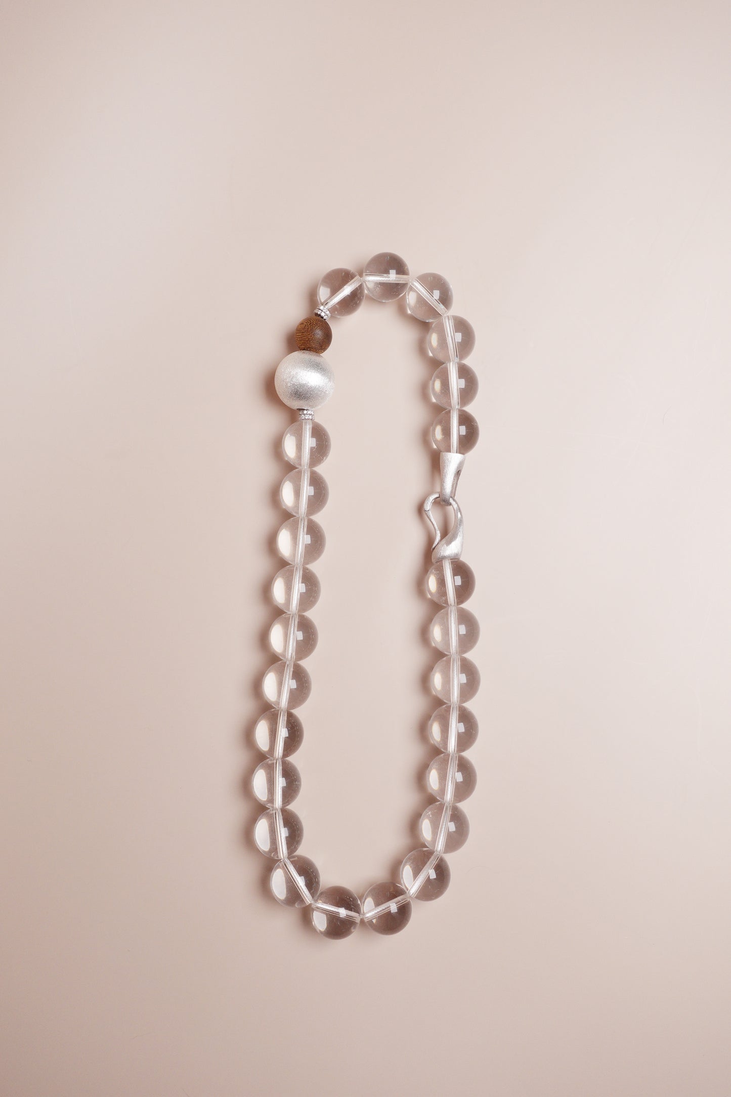 white crystal necklace with agarwood and sterling silver