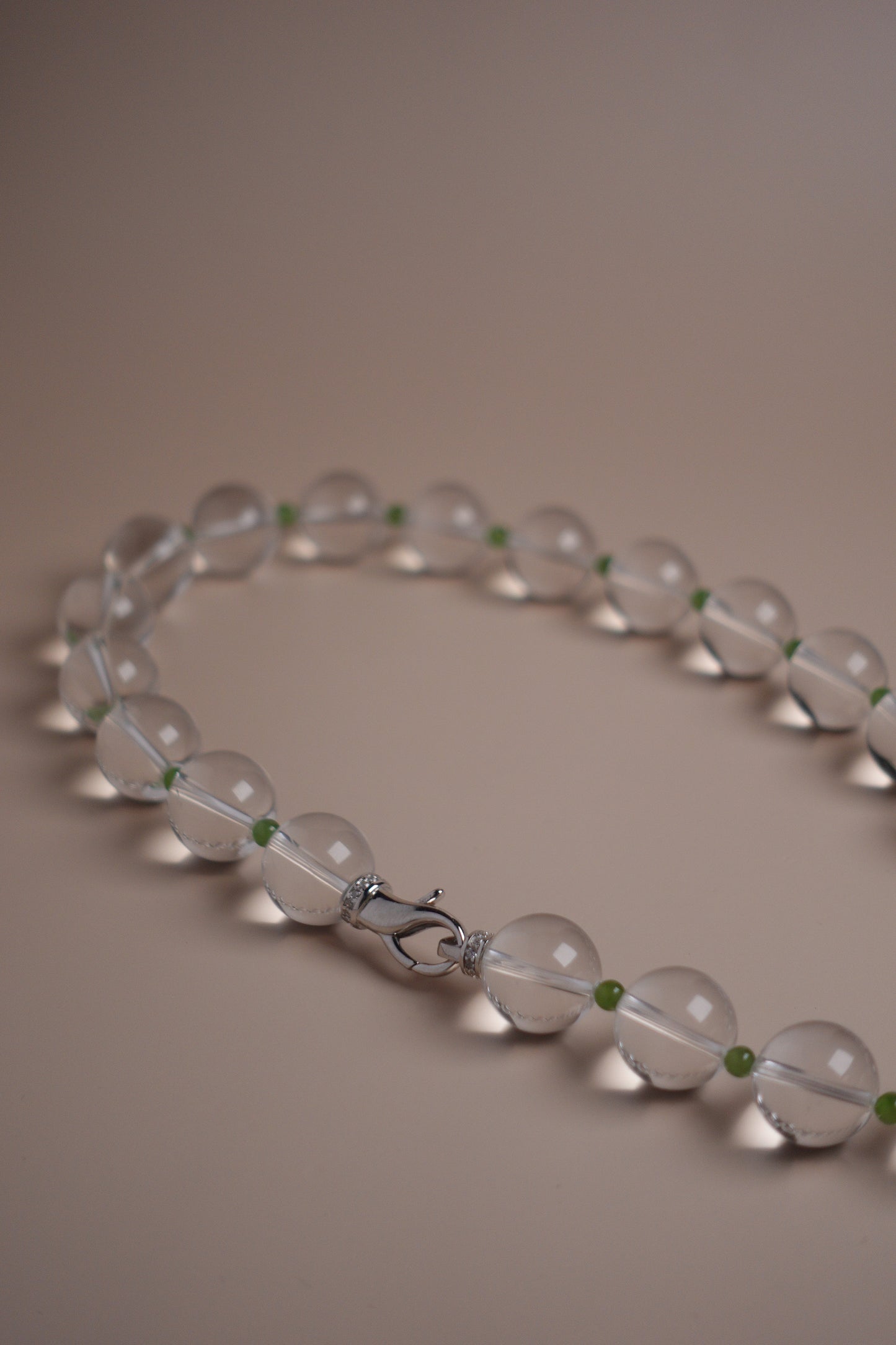 White quartz necklace with silver clasp and green garnet spacers