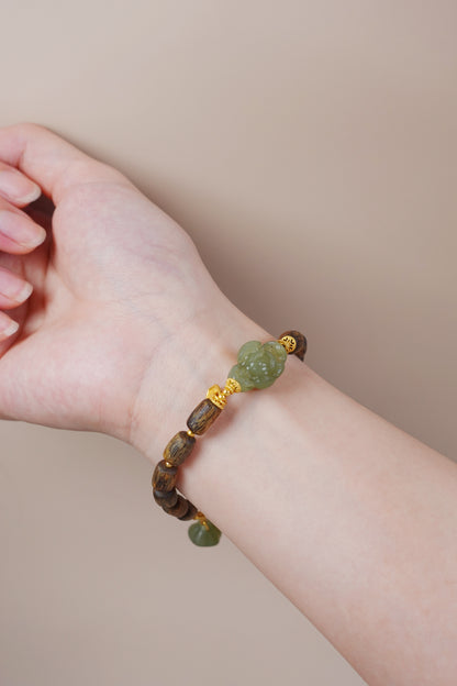 Gold vermeil 'Ten Thousand Taels' charm on jade and agarwood bracelet, feng shui talisman for wealth and abundance
