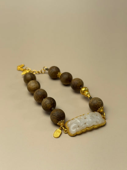 Agarwood and white jade bracelet with floral plaque charm, feng shui jewelry for inner peace and heart chakra