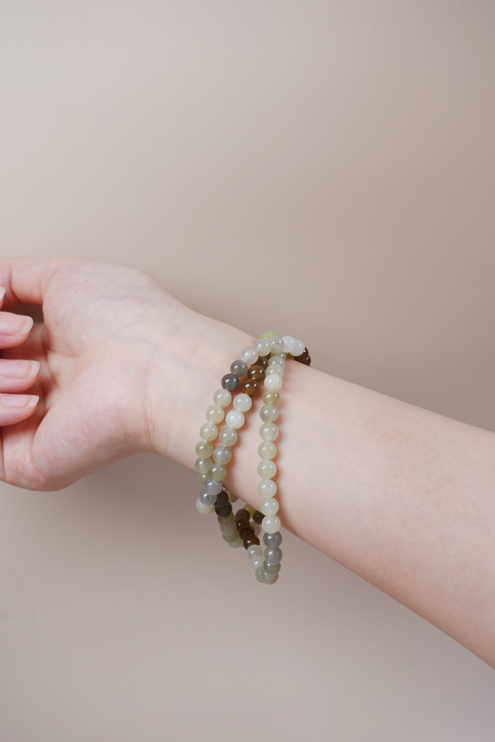 Loulan Hetian jade bracelet necklace in ink, white, and amber-brown tones representing the Five Elements