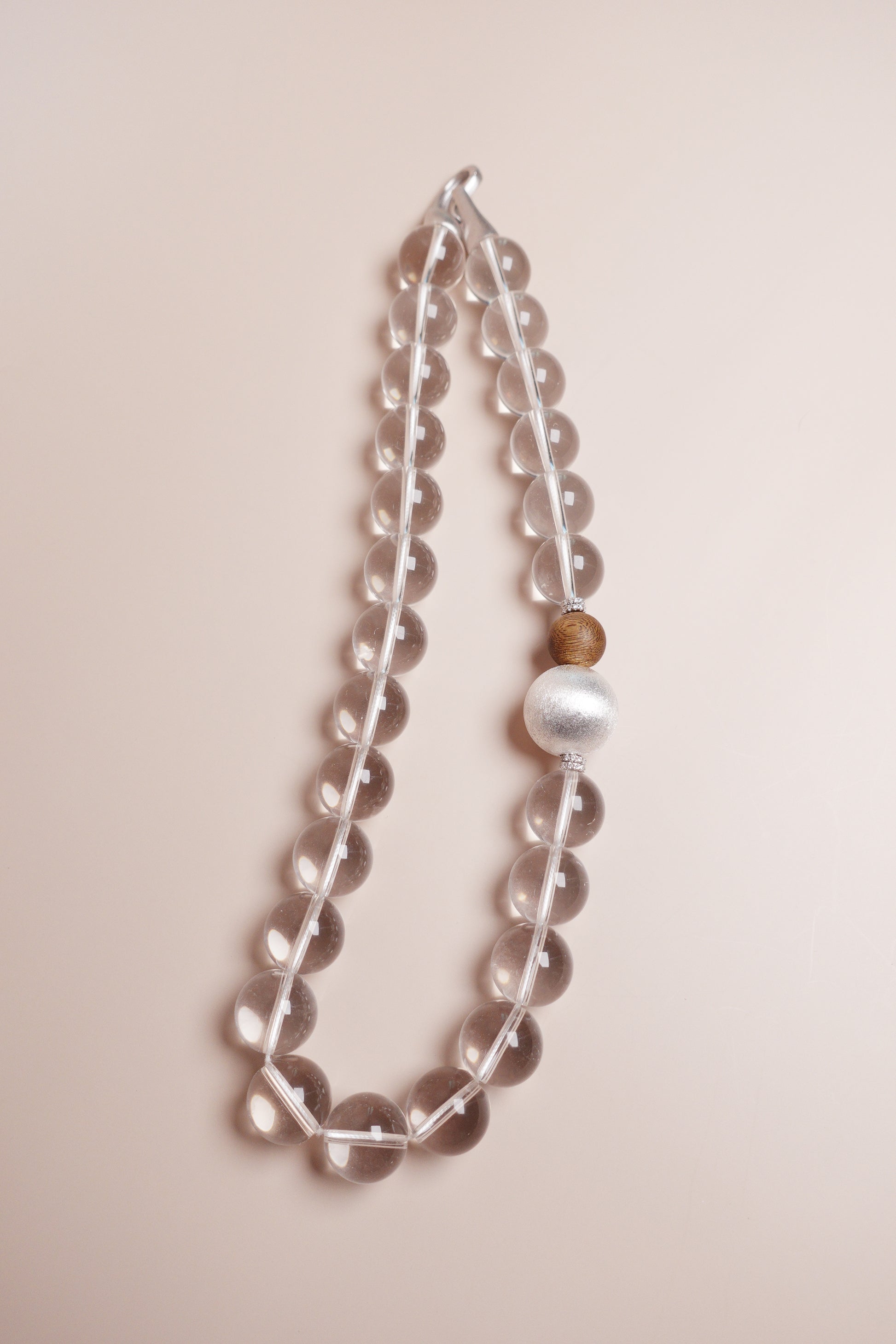 white crystal choker with agarwood and silver bead