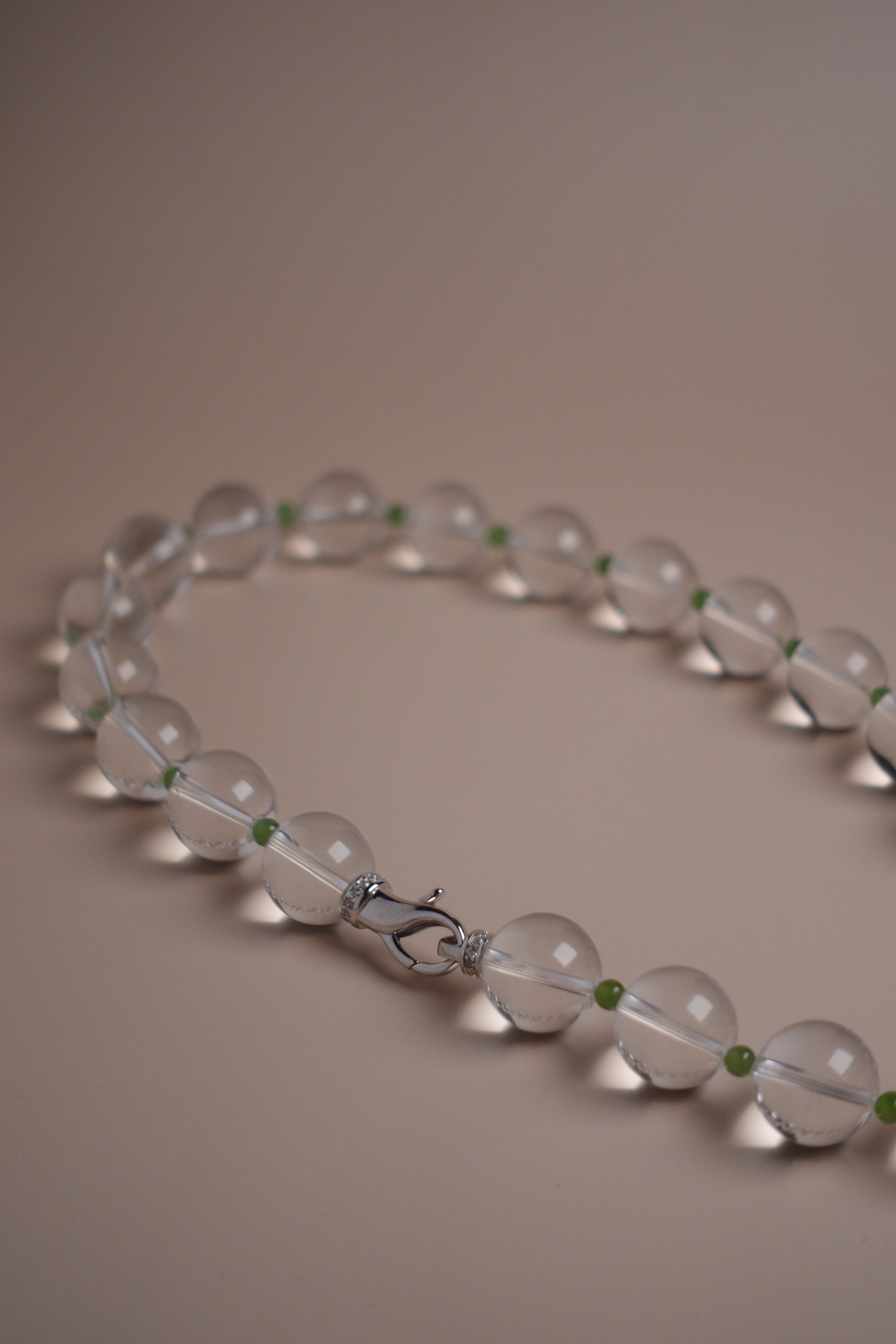 White quartz necklace with silver clasp and green garnet spacers