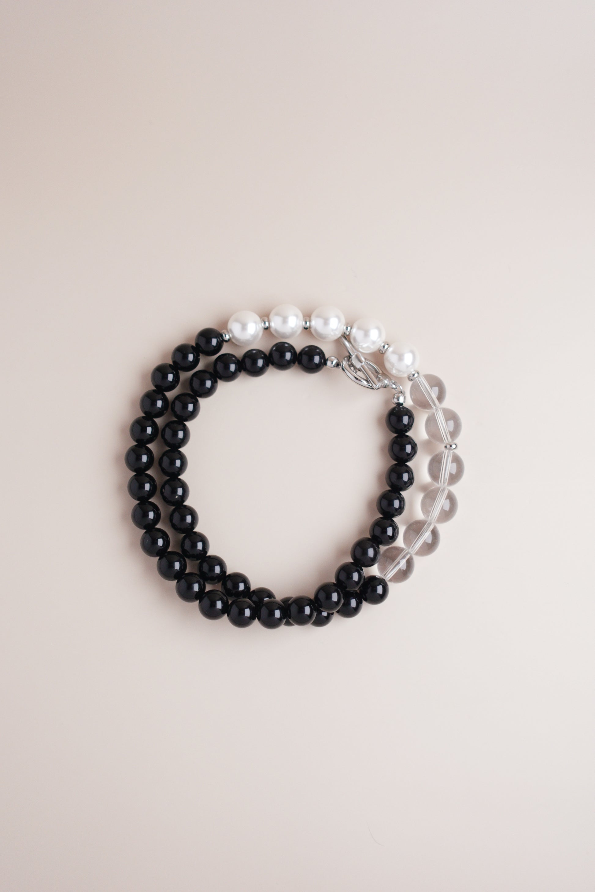 in-Yang Harmony necklace with black onyx and lustrous pearl beads.